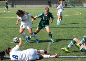Mariner forward Carli Rey retrieves the ball from Quest opponent. Photo via VIU Mariners on Flickr 